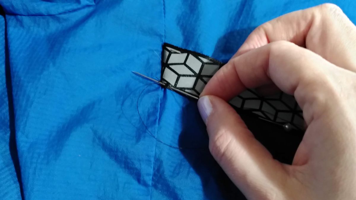 Sewing reflective tape onto a running jacket