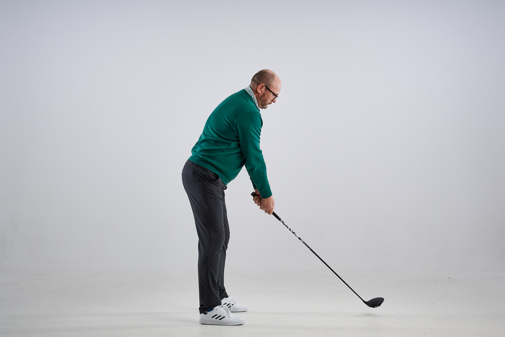 Top 50 Coach Russell Covey demonstrating a correct posture for the golf swing with the chin more elevated and the spine angle improved