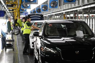 Vehicles are checked before moving to the next stage of production at the Jaguar Land Rover factory on March 1, 2017 in Solihull, England.