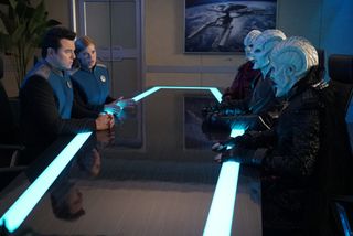 Capt. Mercer (Scott MacFarlane) and Lt. Grayson (Adrianne Palicki) meet with the Krill.