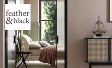 Feather and Black logo placed over an image of a bedroom