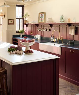 Dark red kitchen with island