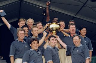 The International Team celebrate their win as they hold up the Presidents Cup Trophy after the 1998 Presidents Cup at the Royal Melbourne Golf Course in Melborne, Australia.