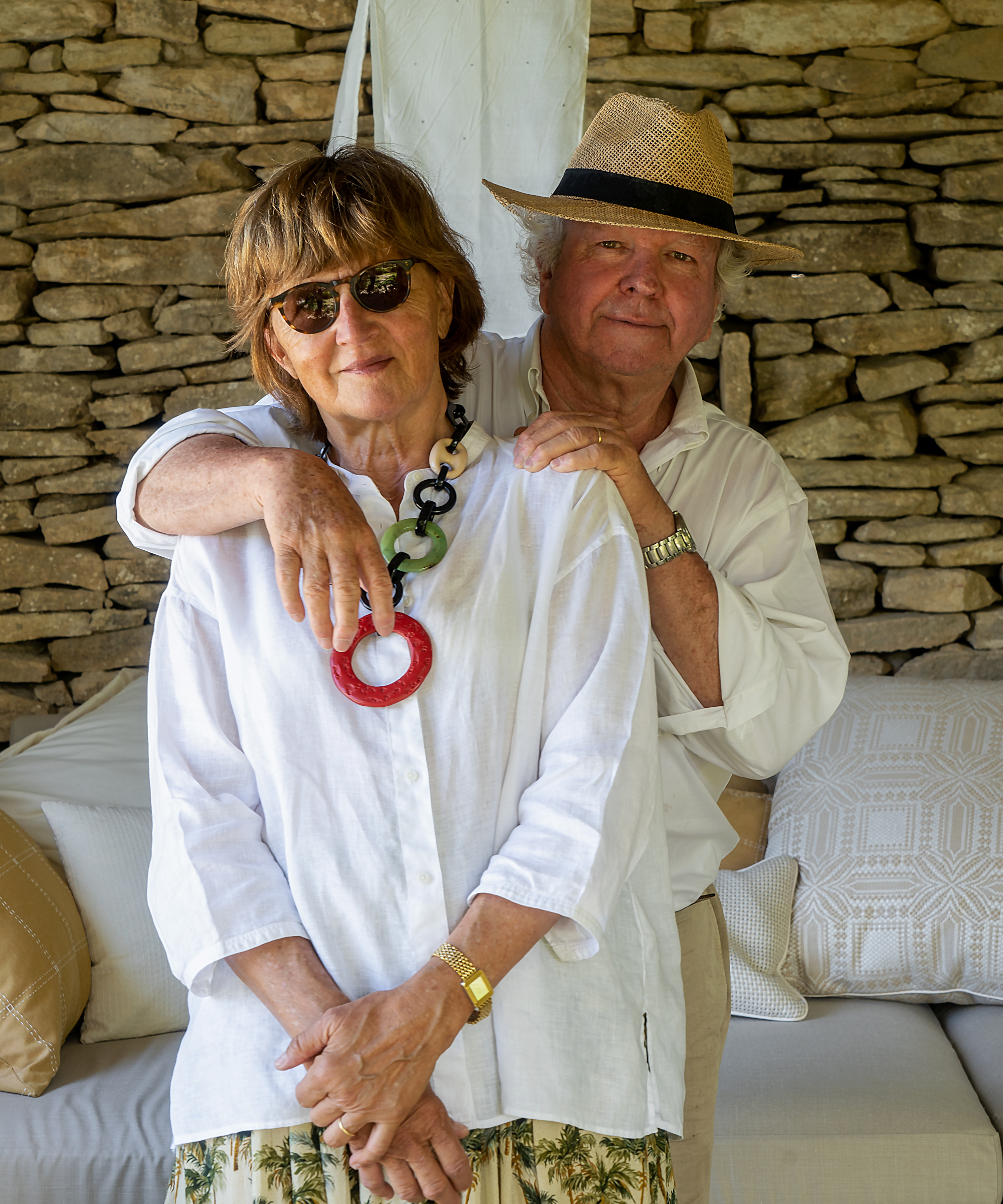 woman wearing sunglasses and man wearing hat