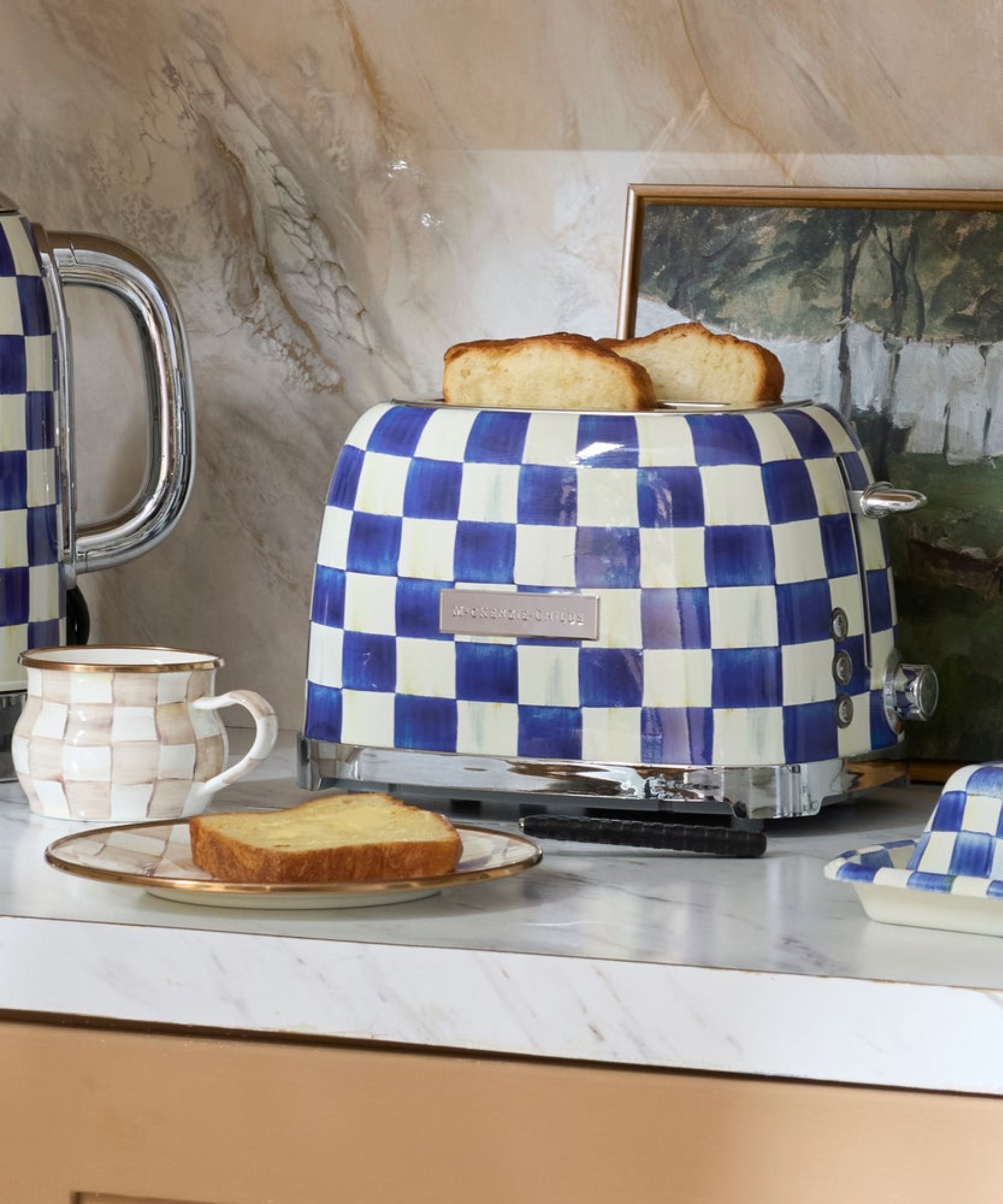 Blue and white check electric toaster on white marble countertop