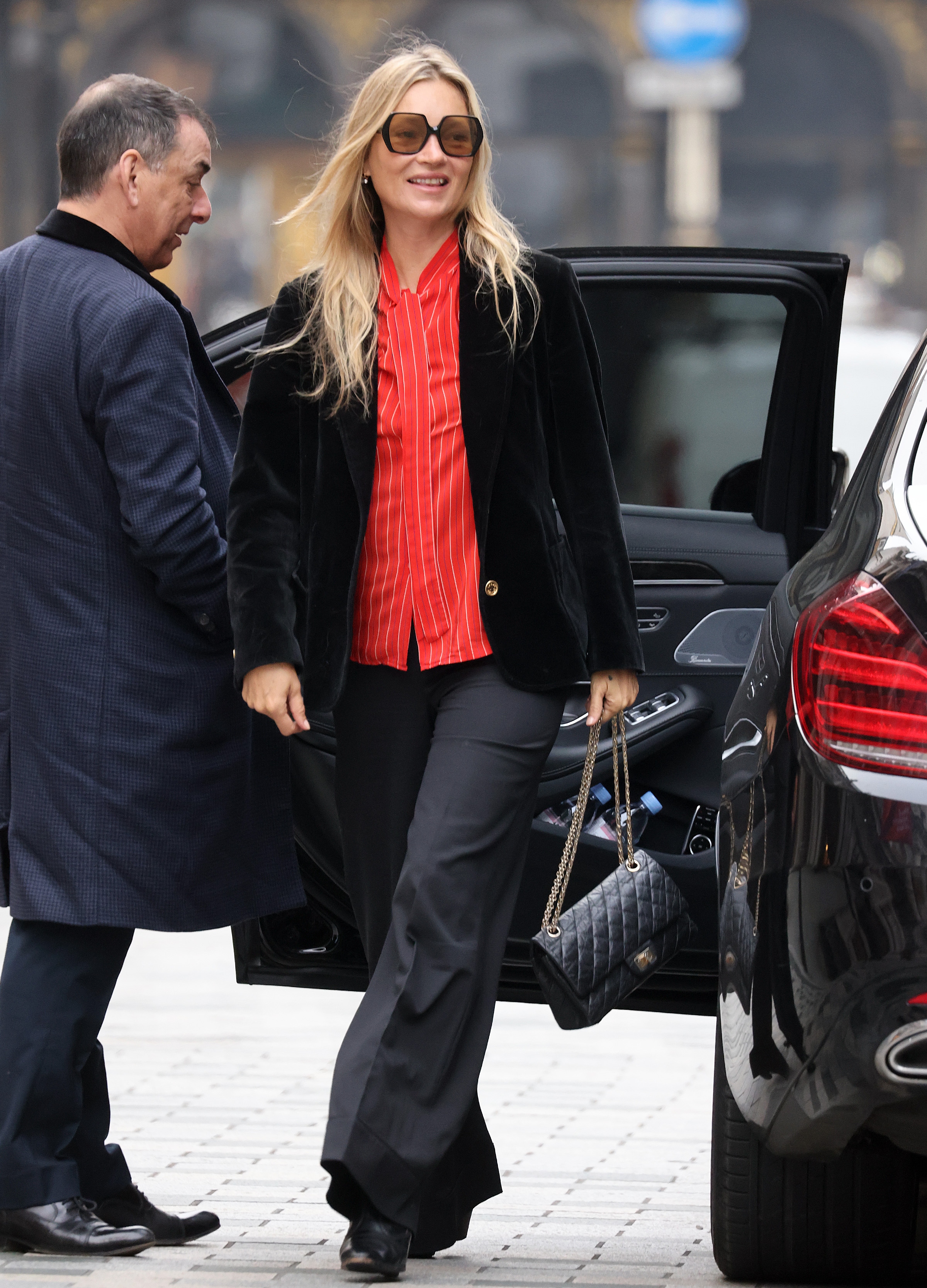 Kate Moss wearing red shirt