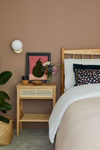 A bedroom with brown wall paint