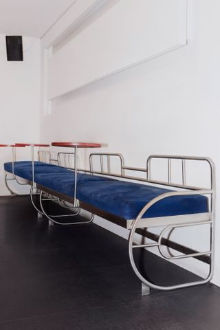 blue bench seating with integral drinks tables