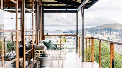 balcony with bamboo sofa and sidetable and view