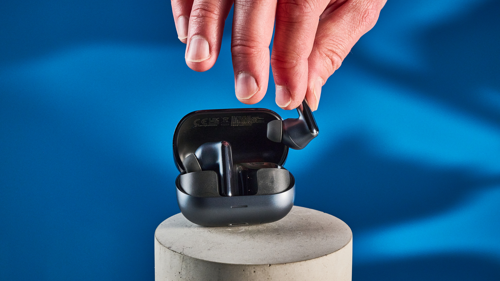 A pair of black Honor Earbuds 4 wireless earbuds