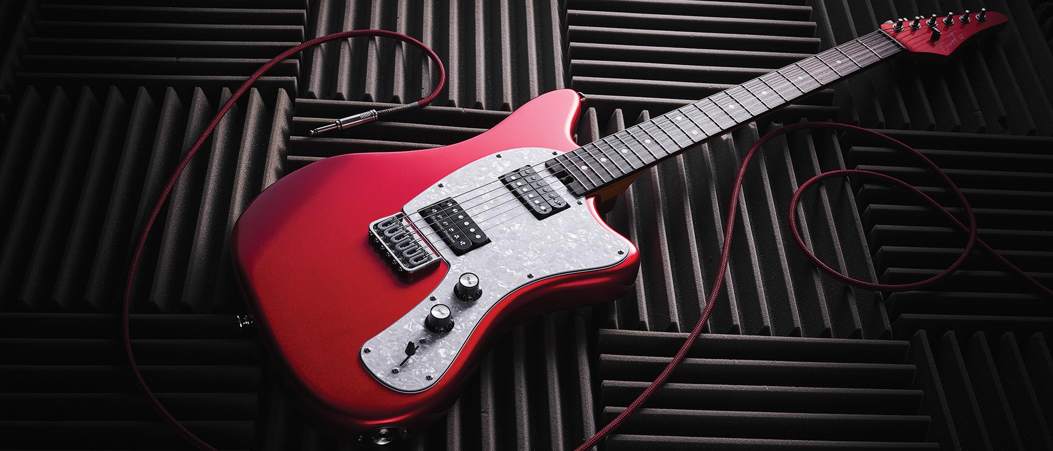 The red hardtail pickup-swapping offset is made in China, and comes with three Seymour Duncan and Guitar-X pickups included