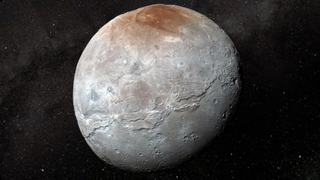 A grey cracked sphere with a reddish brown cap