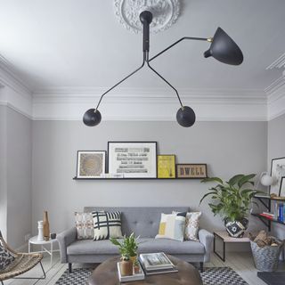 grey living room with big designer pendant light
