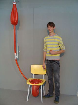 Red rubber tube with balloon, attached to a chair