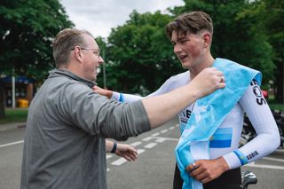 Josh Tarling with his dad Michael after winning the 2024 British National Time Trial Championships