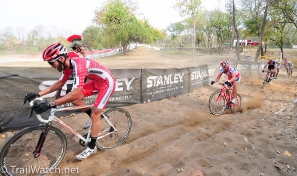 Geoff Kabush (Team Maxxis) leads fellow mountain biker Todd Wells and others through a long sand pit.