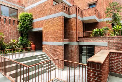 view of Gujral House, the house of Satish Gujral, from courtyard with brick volumes cascading
