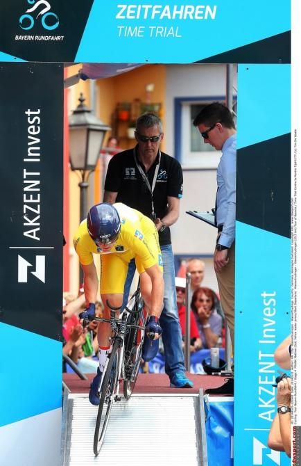Yellow jersey Matthias Frank (IAM Cycling) rolls down the start ramp