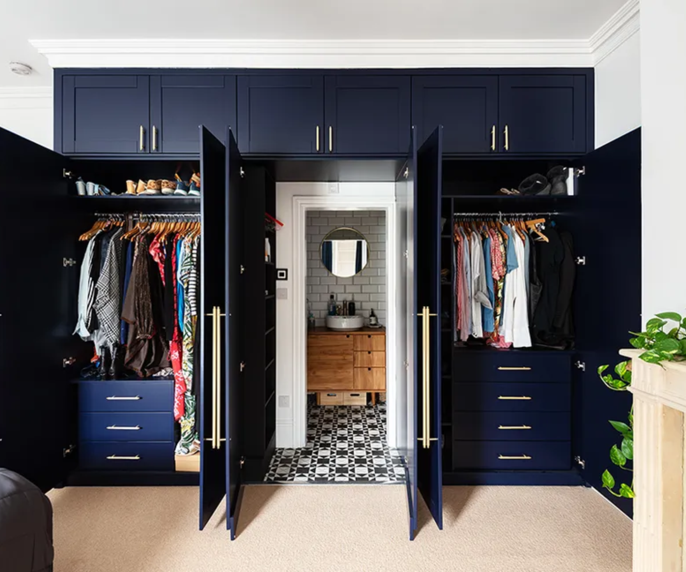 Ensuite hidden behind a fitted navy wardorbe