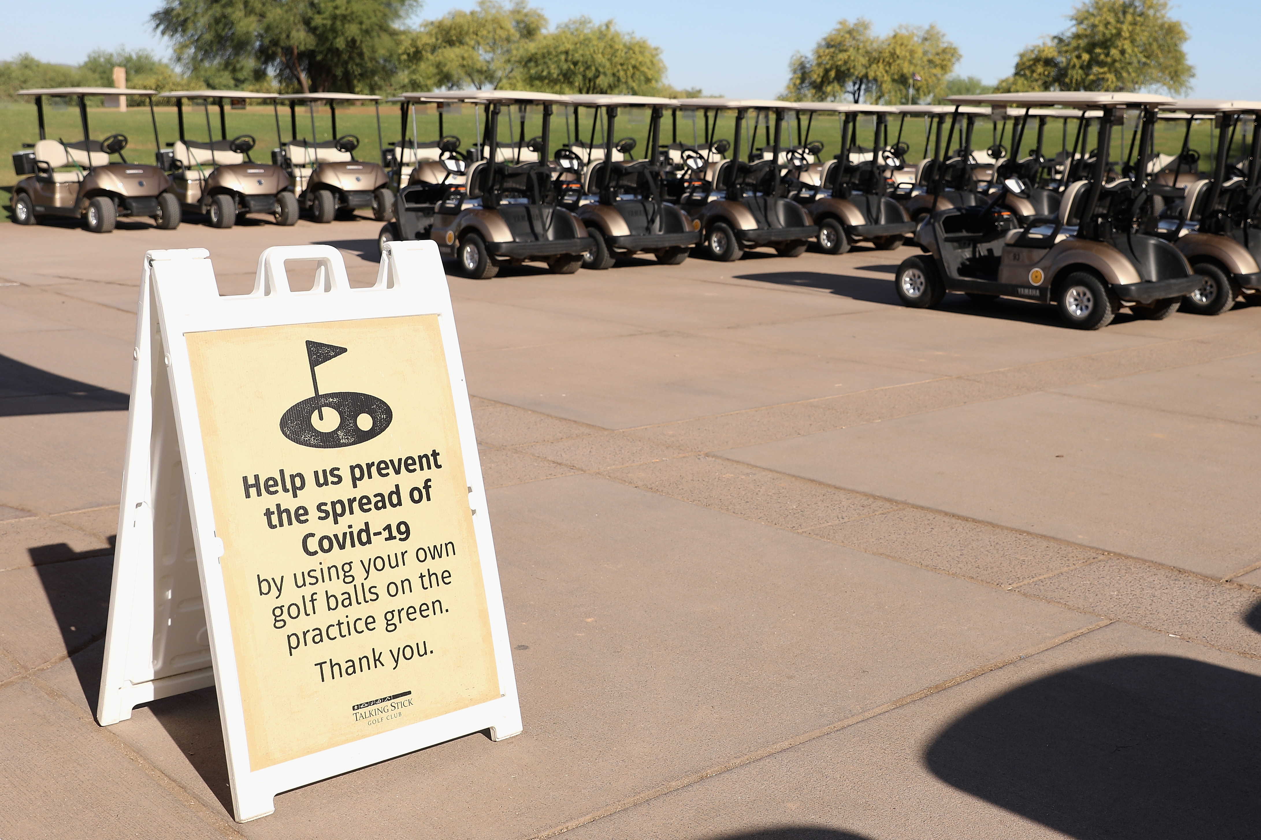 A sign reminding players to use their own golf balls on the practice greens is displayed to help with social distancing and combat Covid-19