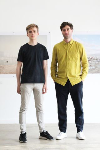 architects posing in front of their display of drawings at the Glasgow architecture fringe 2021