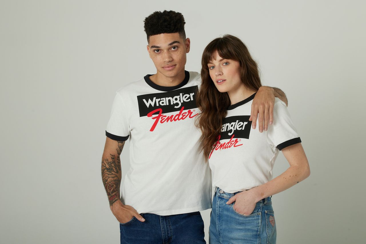 Two models model clothing items in the Fender x Wrangler collection
