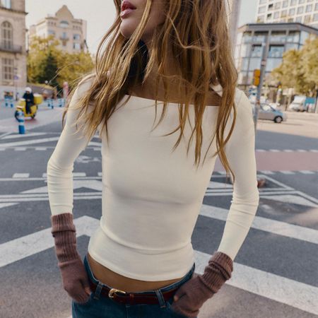 Woman in a white Zara top