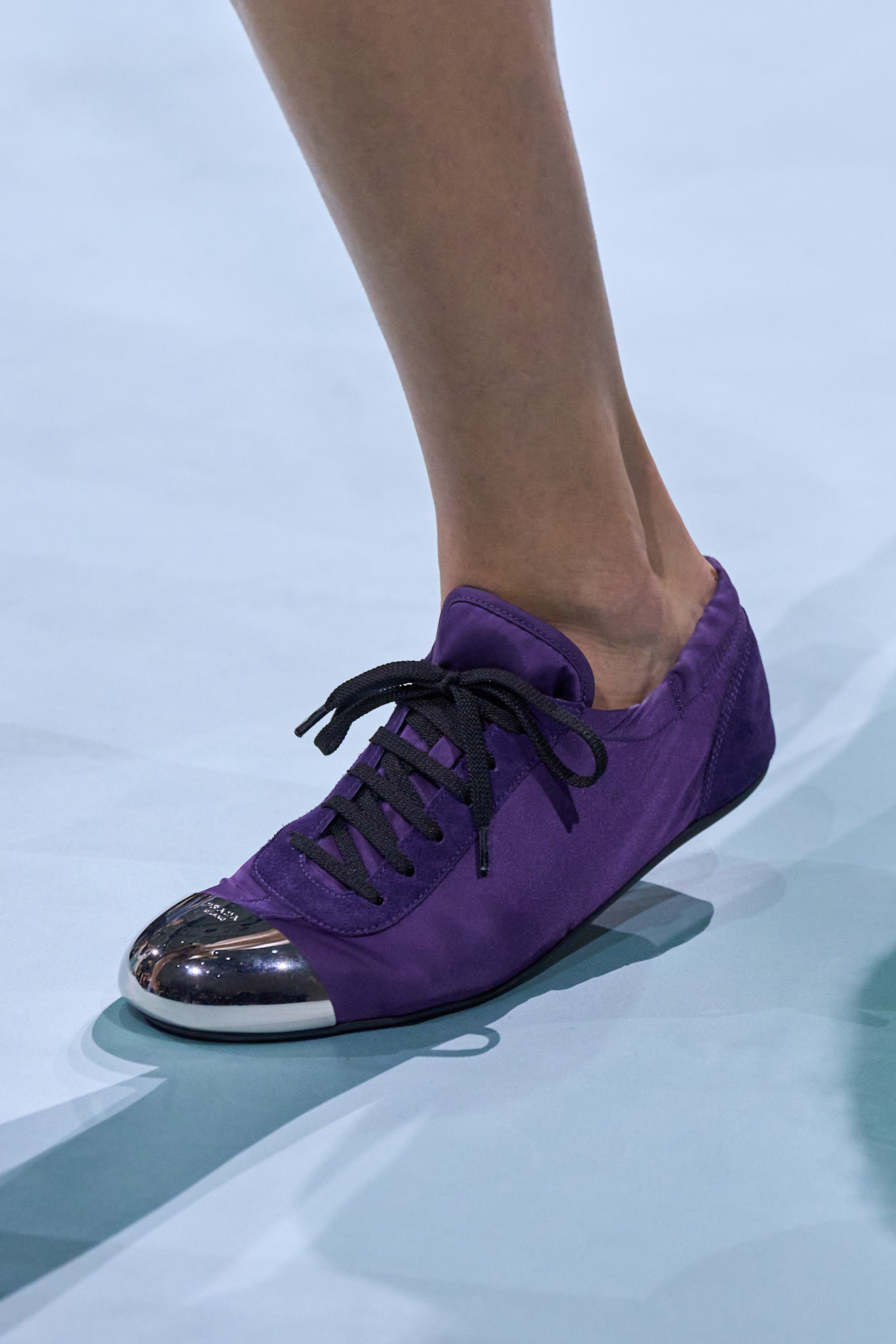 A picture of Prada&#039;s low-profile nylon collapsible trainers.