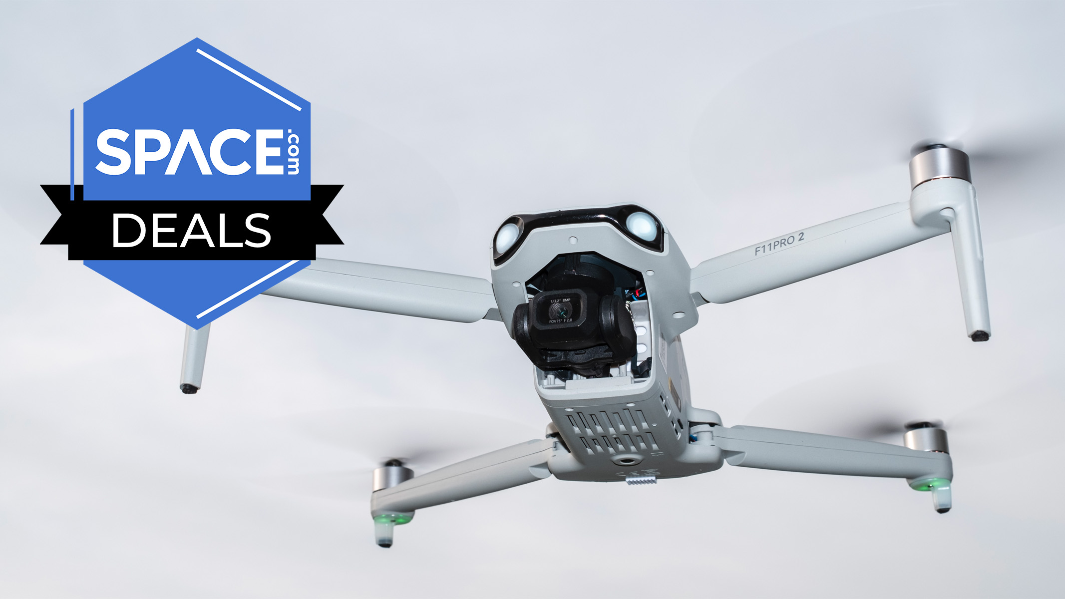 A Ruko F11PRO 2 drone against a cloudy sky. 