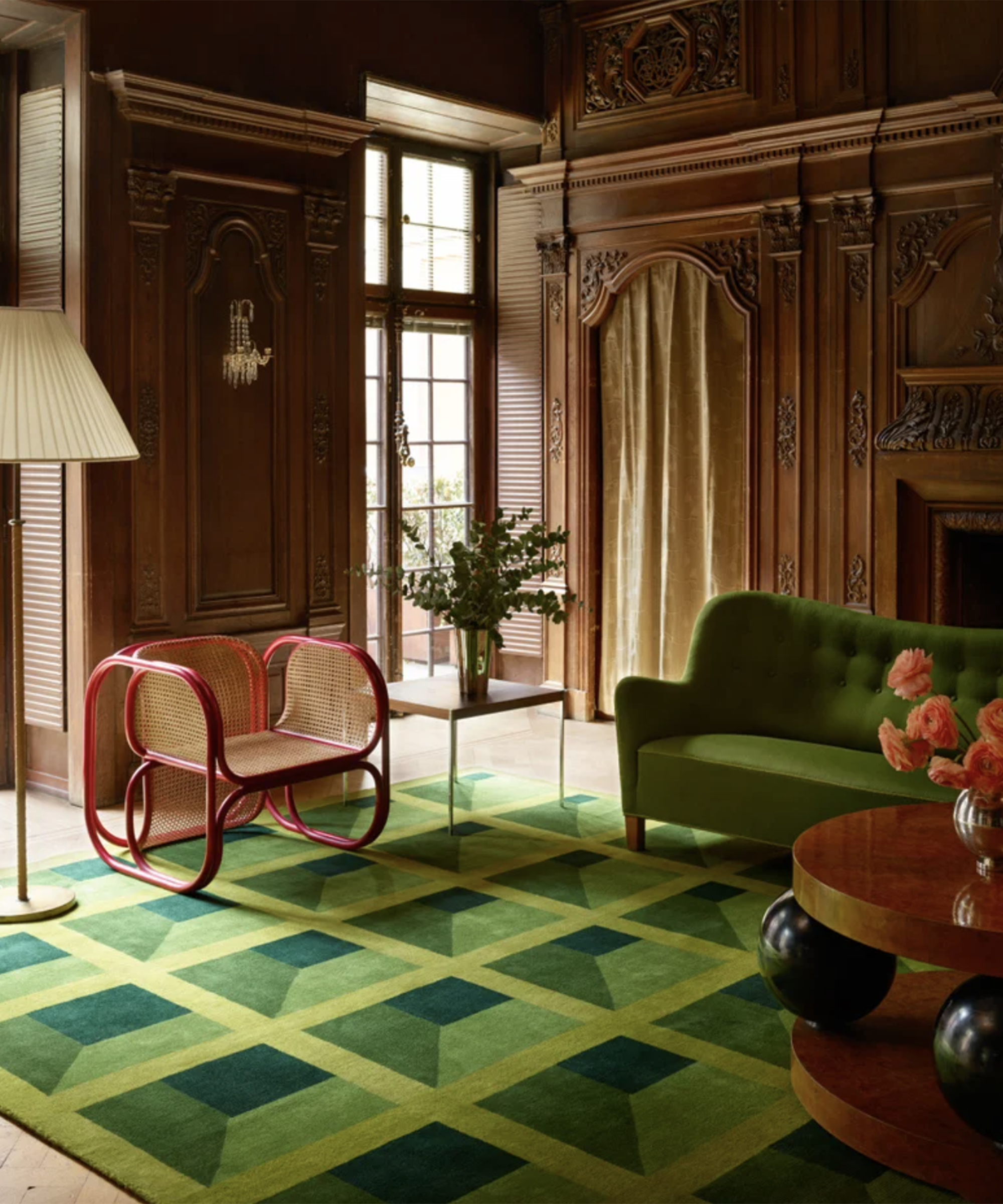 green rug on the floor of a large living room