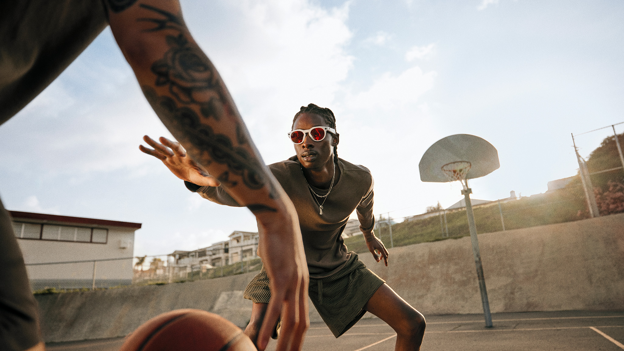 Official lifestyle shots of a person wearing Oakley Meta HSTN smart glasses