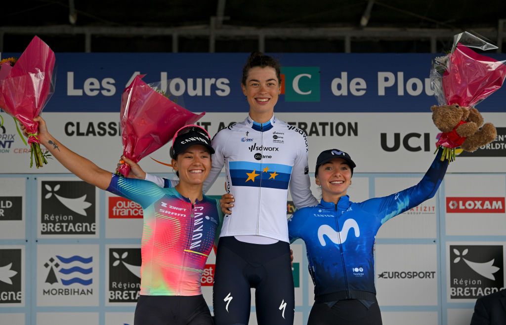 PLOUAY FRANCE AUGUST 24 LR Chloe Dygert of The United States and Team CanyonSRAM Racing on second place race winner Mischa Bredewold of The Netherlands and Team SD Worx Protime and Liane Lippert of Germany and Movistar Team on third place pose on the podium ceremony after the 24th GP de Plouay Lorient Agglomeration Trophee CERA 2024 a 158km one day race from Plouay to Plouay UCIWWT on August 24 2024 in Plouay France Photo by Luc ClaessenGetty Images