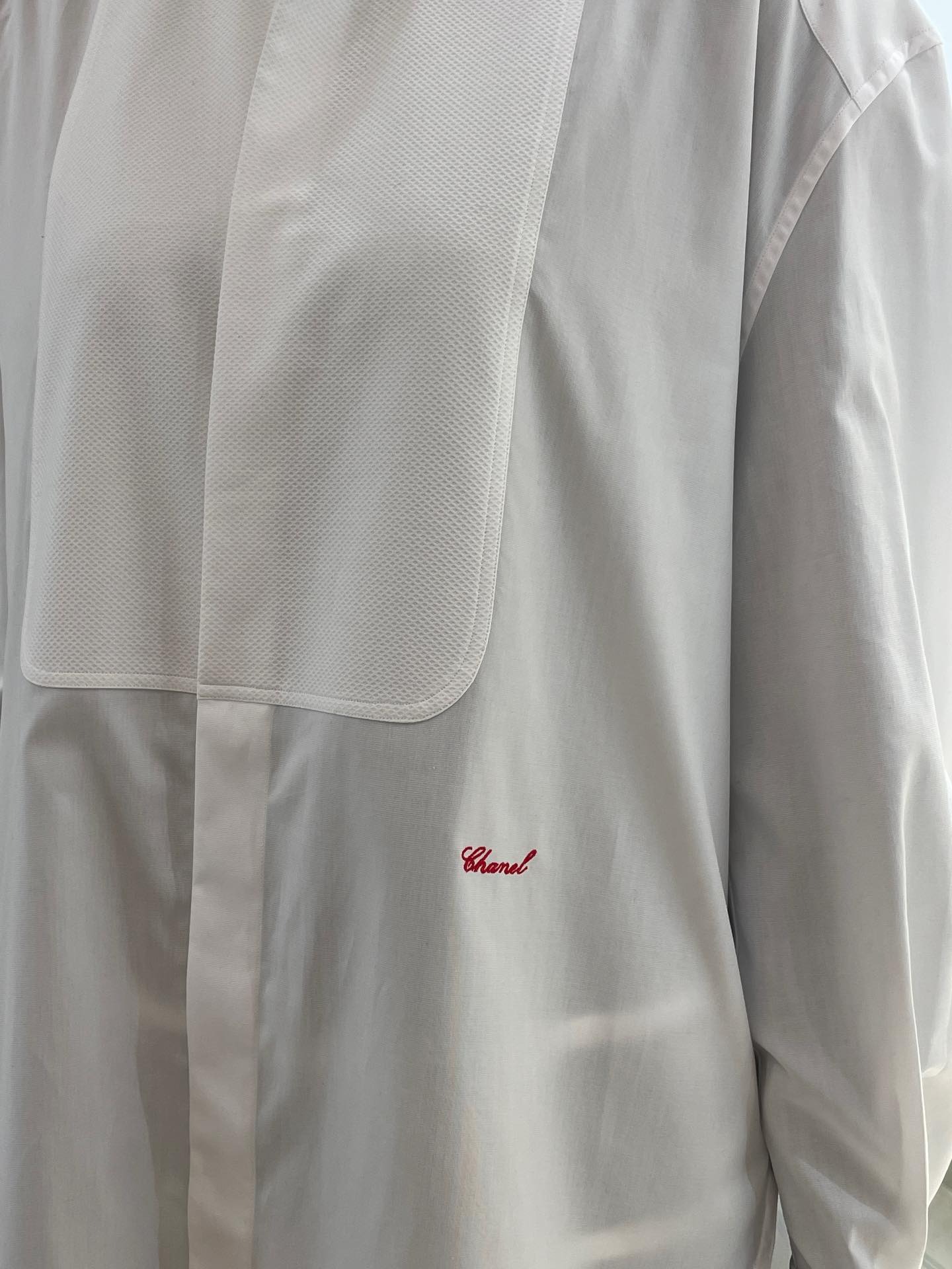 A close-up of Chanel's Charvet tuxedo shirt.