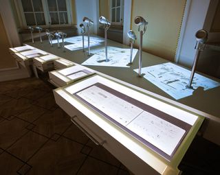 As visitors open the drawers, sheets of music appear to float out onto the table.