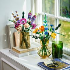 LEGO wildflowers collection in clear vases on windowsill