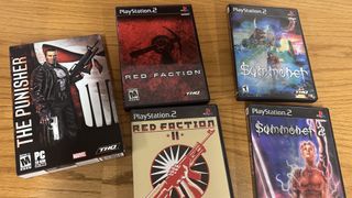 A photo shows a collection of physical Volition releases that belonged to the developer