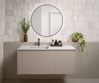 light stone coloured wall mounted vanity unit with fluted doors