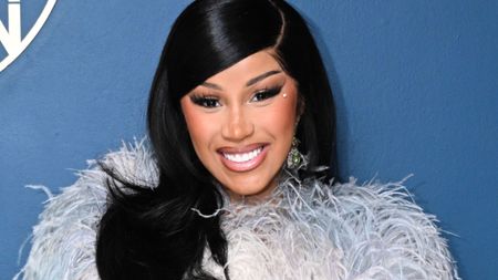 cardi b on a blue background