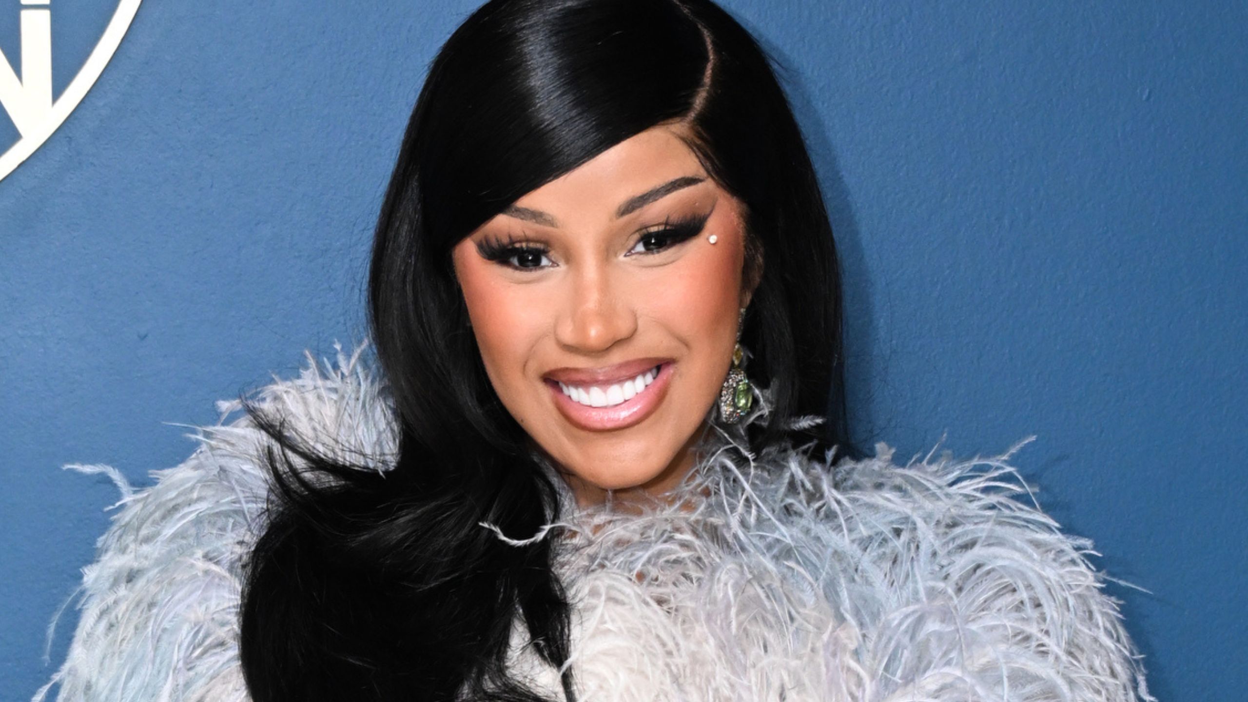 cardi b on a blue background