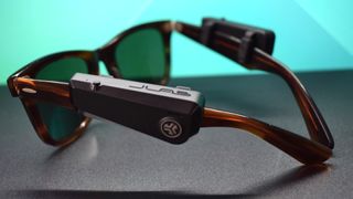 JLab JBuds Frames photograph showing speakers on a pair of Ray-Ban sunglasses from behind