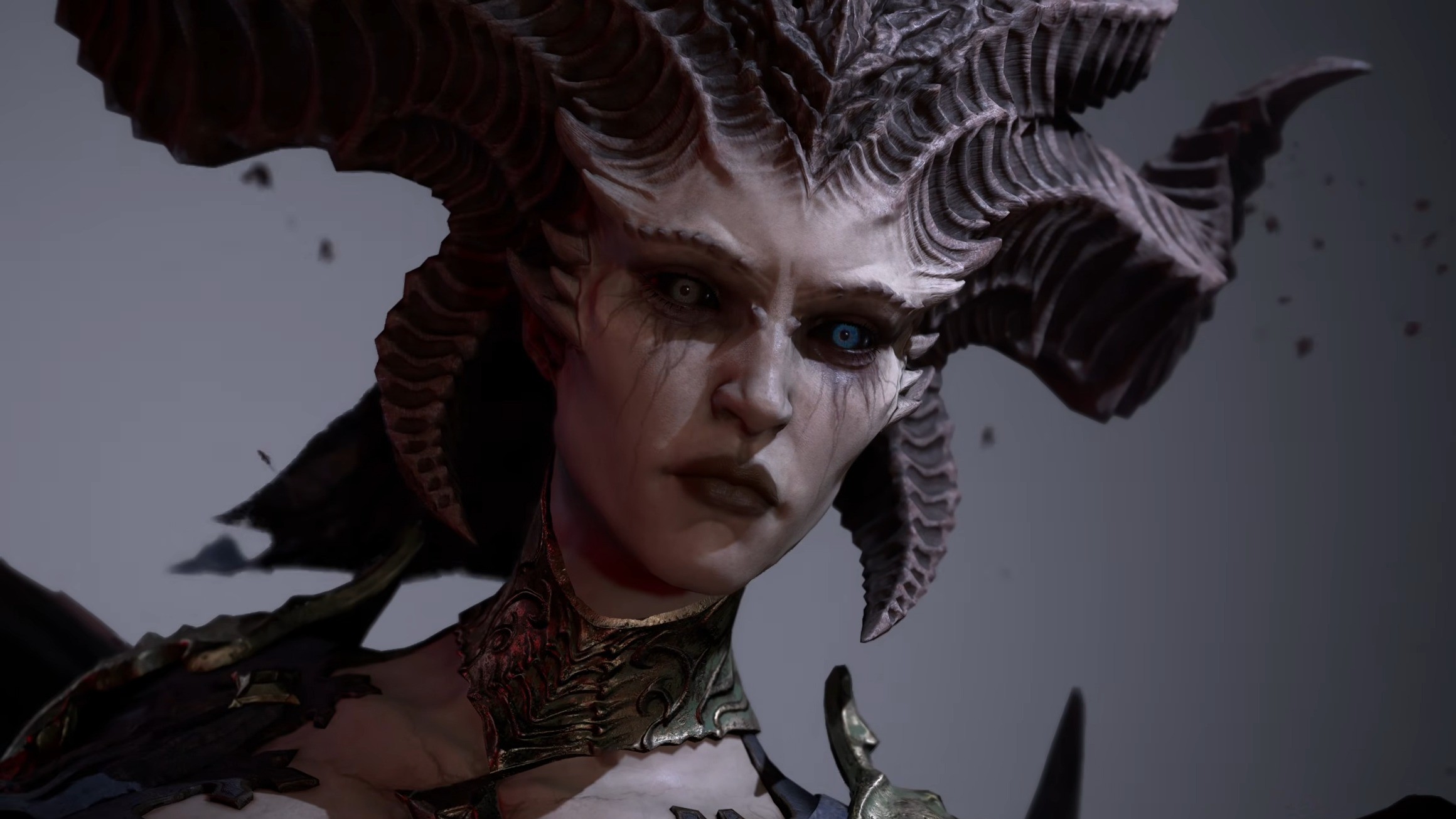 A fierce mythical creature with intricate, curling horns and sharp facial features gazes intensely.