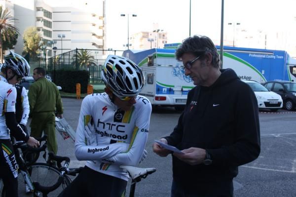 A tired Tejay Van Garderen listens as the day's ride is explained