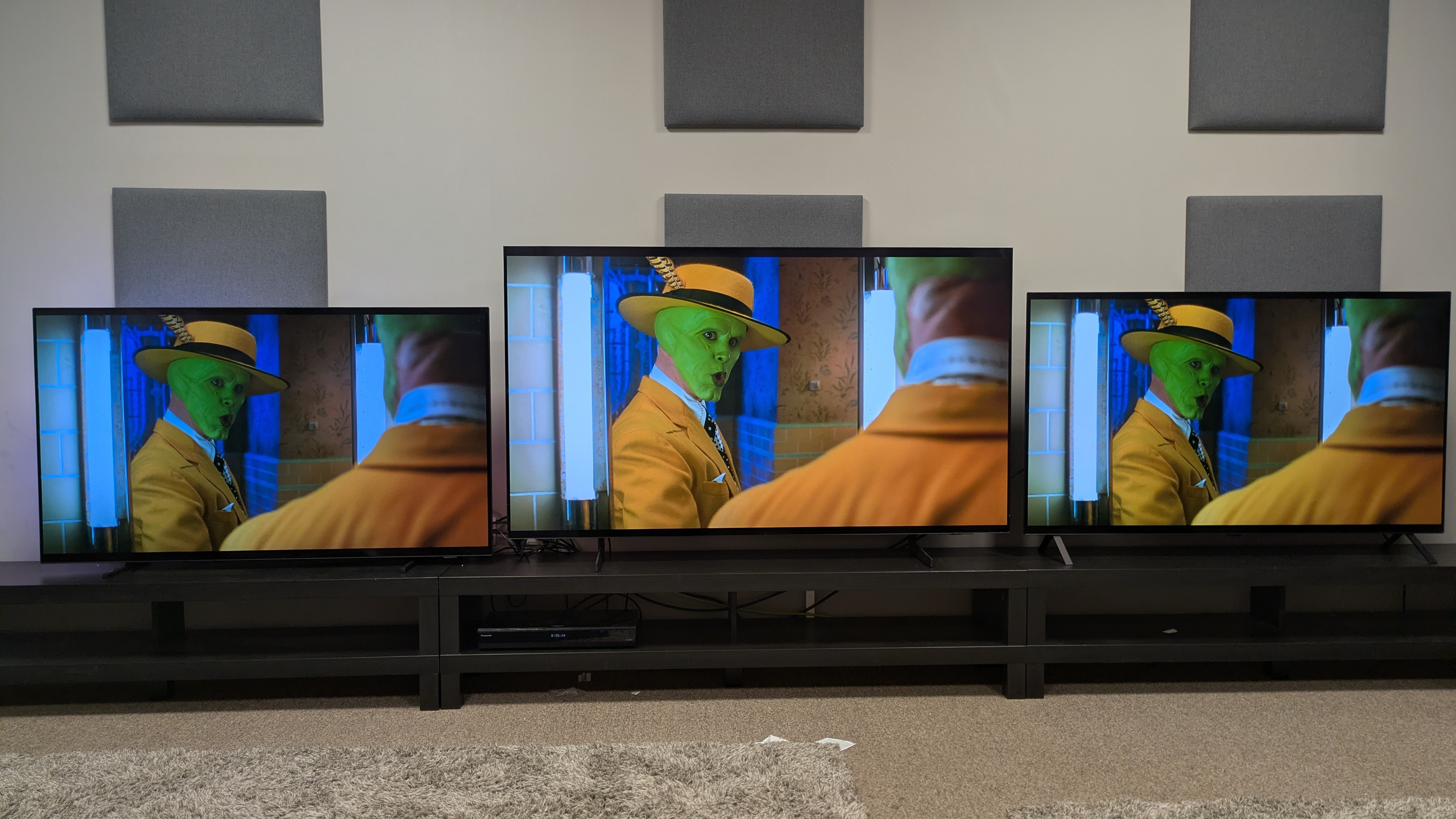 Philips OLED760 vs Samsung S85F vs LG B5 showing The Mask in front of a mirror on screen 