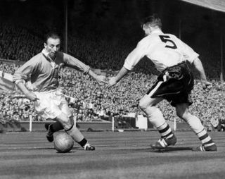 Stanley Matthews in action for Blackpool against Bolton Wanderers in the 1953 FA Cup final