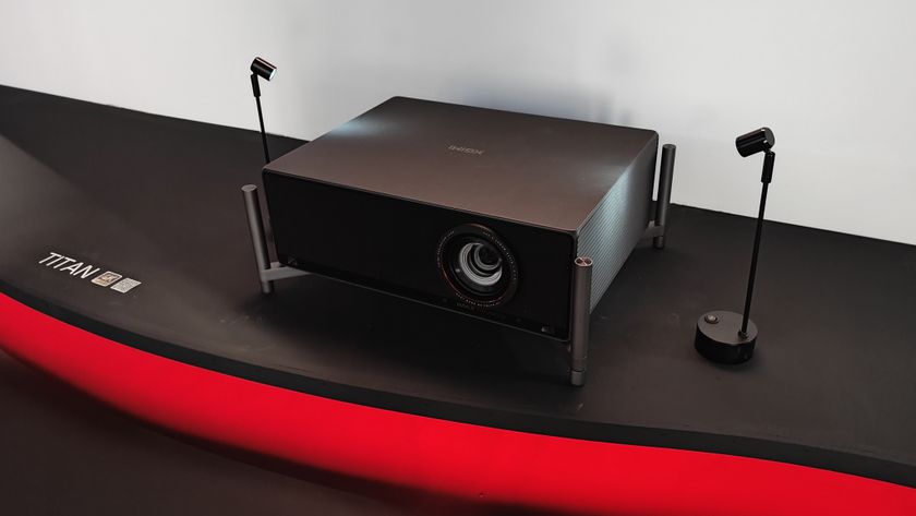 Xgimi Titan projector on display at IFA on a red shelf.