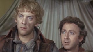 Donald Sutherland and Gene Wilder standing next to each other wide-eyed in Start the Revolution Without Me