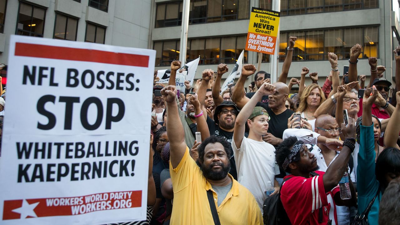 Activists rally in support of Colin Kaepernick outside NFL headquarters in New York