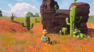 Fishstick stands in front of some cacti in the Dry Valley region of Lego Fortnite