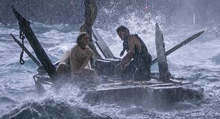 Galadriel and Halbrand ride out the storm on a raft in The Rings of Power