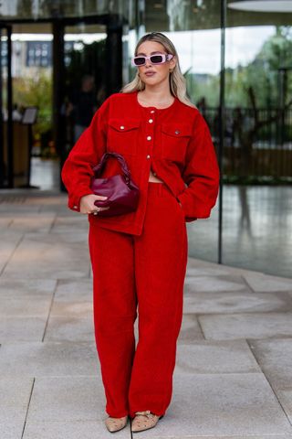 Woman in red co-ord GettyImages-2165953446